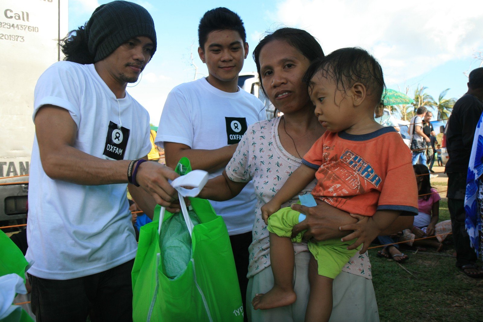 Dolor Moralde receives a hygiene kit from Oxfam. The hygiene kit contains soap, a blanket, clean underwear and toothbrushes.