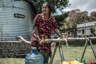 With roads and infrastructure badly damaged, it is difficult to obtain clean, potable water. Oxfam has installed a water tank in Tundikhel camp that can hold up to 11,000 litres of drinking water for survivors. (Photo: Pablo Tosco/Oxfam)