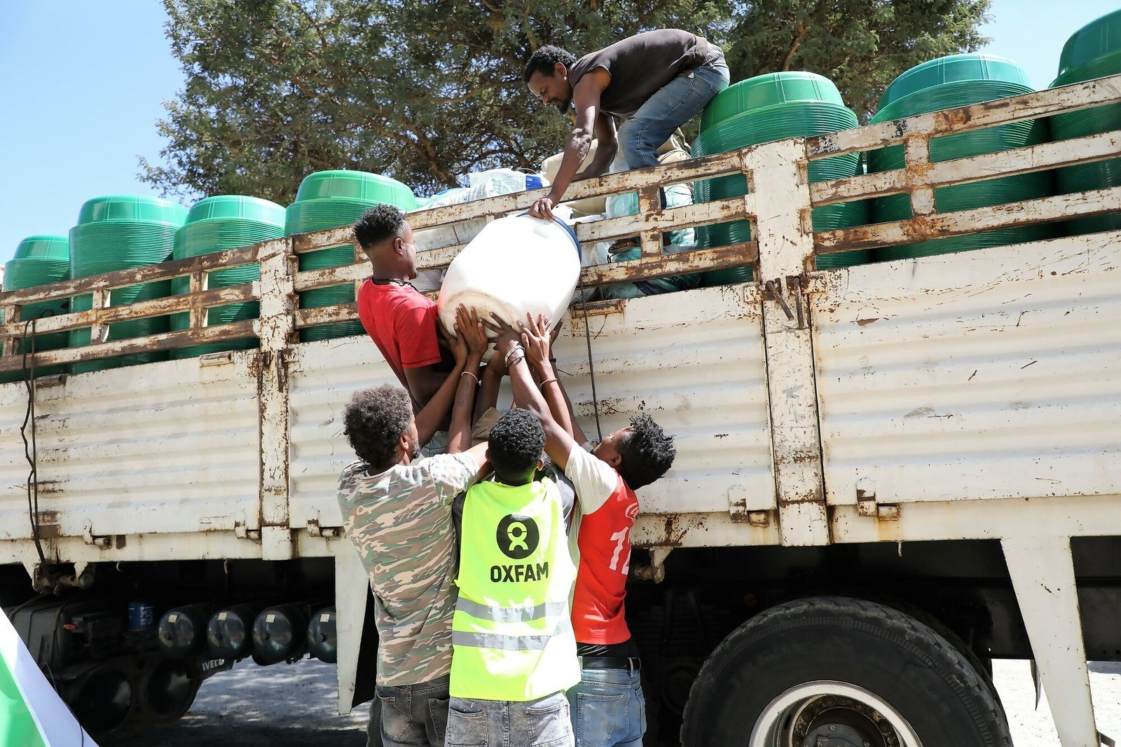 Men loading truck with humanitarian relief.