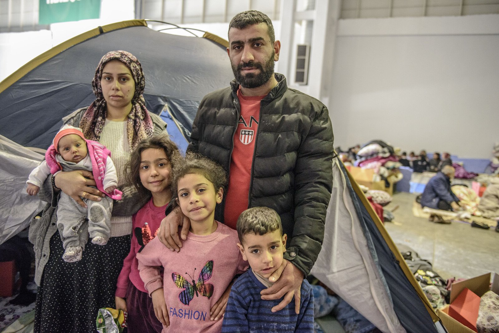 Ali Dalmen, his wife Betul and their four children survived the earthquake and now live in a warehouse building that is housing up to 7,000 people seeking shelter and refuge.  ‘We were shaking and we were so scared; I thought it was my last day. When I looked at the walls, I felt like they were moving towards me, so we went to a wide space to keep us safe,’ Ali Dalmen told us.